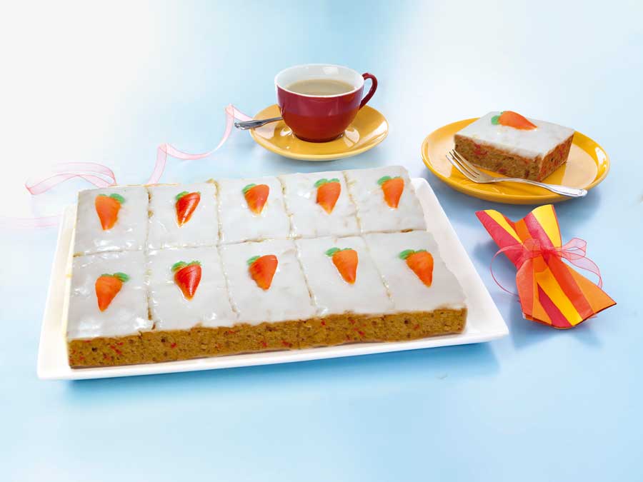 Foto: EDNA Ein ganz besonderer Blickfang ist die Rübli-Schnitte mit augenfälligen Zucker-Dekorauflegern in Karottenform.